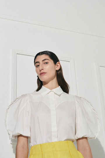 Turista shirt in 100% Cotton from Australian designer PALMA MARTÎN. Pleated ruffle detailed sleeves are both playful and nostalgic. 